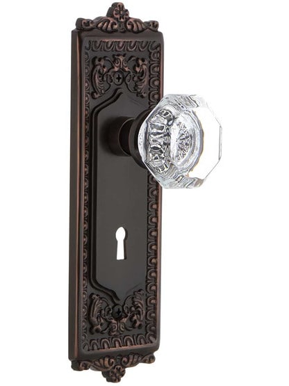 Egg and Dart Design Mortise Lock Set With Waldorf Crystal Knobs in Timeless Bronze.